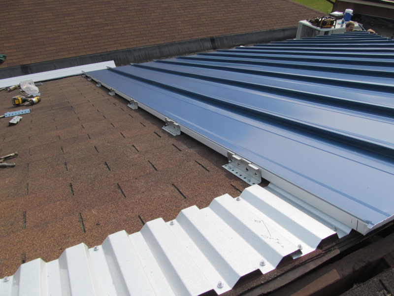 McElroy Metal Offers Standing Seam System To Cover Asphalt Shingles How To Combine Metal Roof With Asphalt Shingles